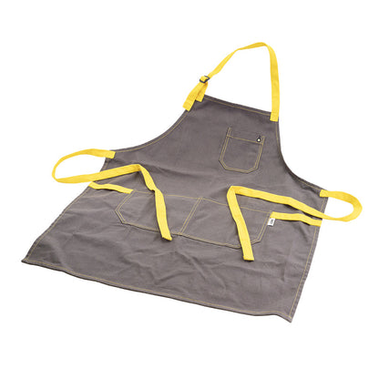 Apron laid out, displaying 3 pockets, neck strap, and back ties.