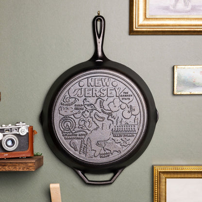 Decorative state cast iron skillet displayed on wall.