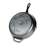Cast iron skillet with bear design and 'Lodge' branding.