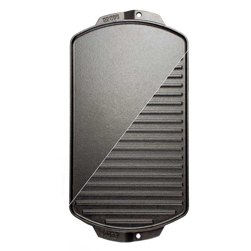 A black cast iron reversible grill/griddle with grooves on one side and a smooth surface on the other, branded with 'Lodge'.