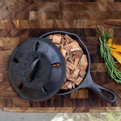 Skillet filled with woodchips ready to be used to smoke dish.