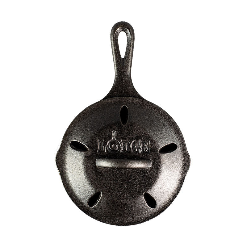 Cast iron skillet with lid which has holes to facilitate smoking.