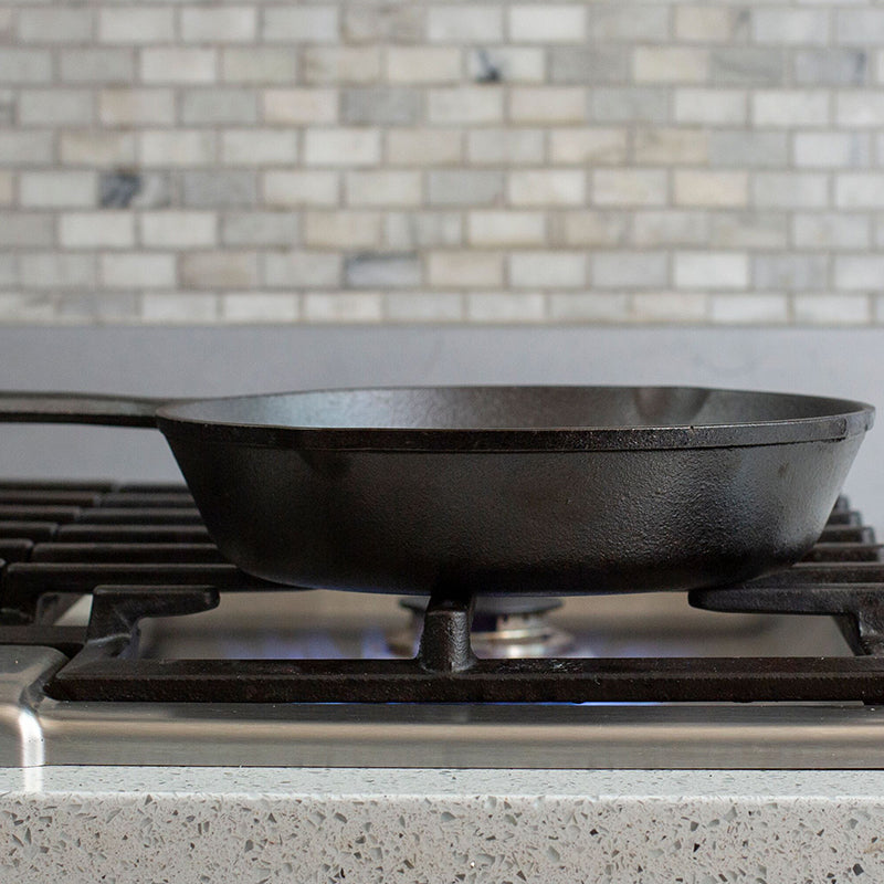Side profile of skillet being used on stove.