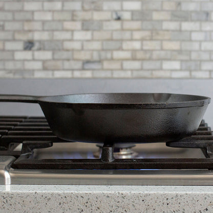 Side profile of skillet being used on stove.