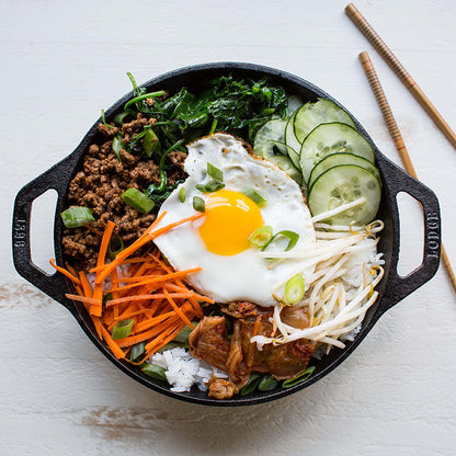 Stir fry bowl freshly prepared and served in wok with chopsitcks.