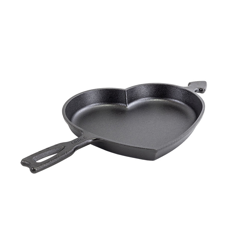 Seasoned cast iron pan in shape of heart.
