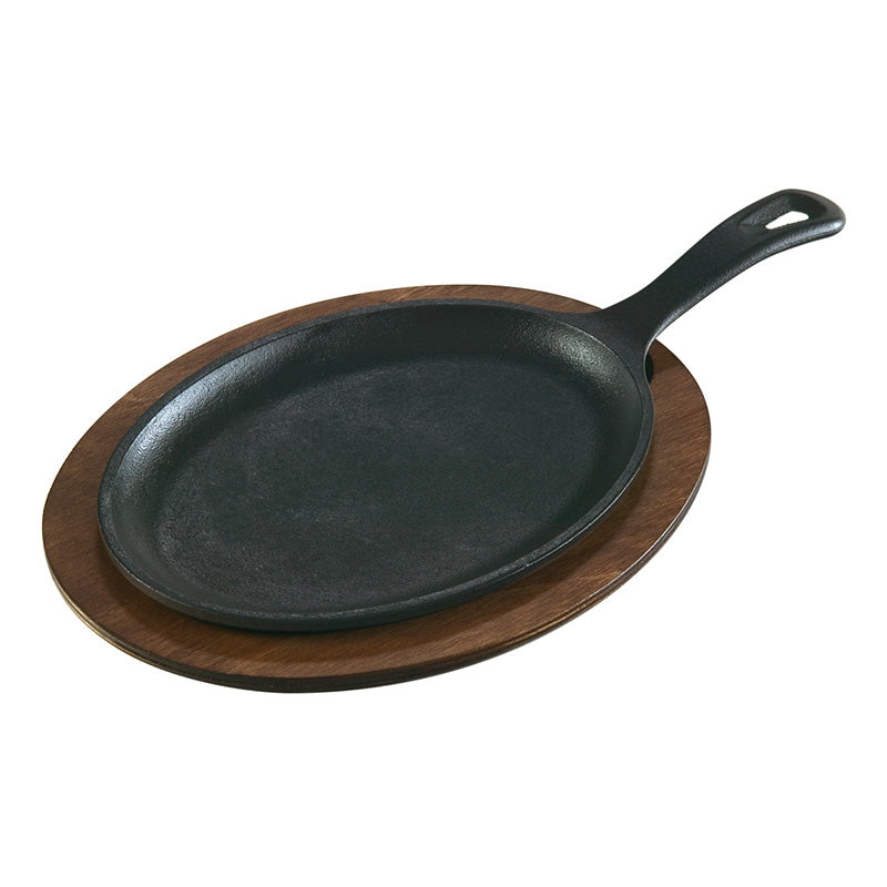 Fajita griddle on wood underliner.