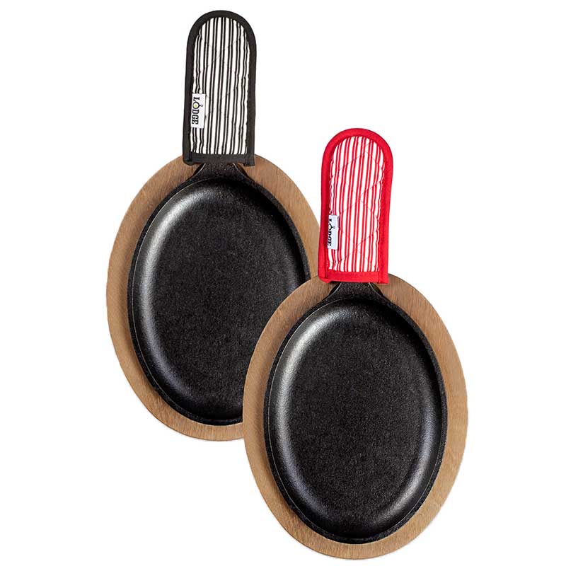 Top view of set showing the cooking area and the fabric handle holder patterns, one is red with white strips, the other is black with white stripes.