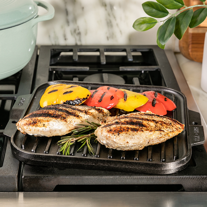 Grilled chicken and peppers, freshly prepared on pan over stove.
