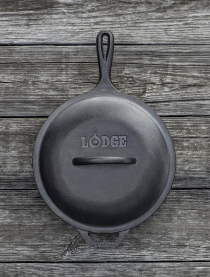 Top view of lid on skillet, displaying branding and handle.