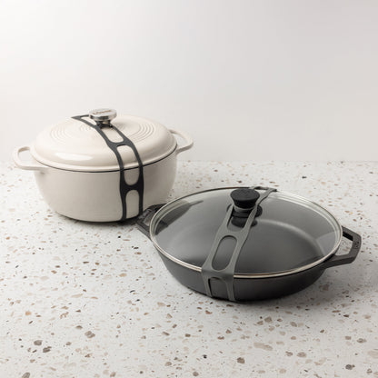 Both lid latches being used on a dutch oven and glass lid.