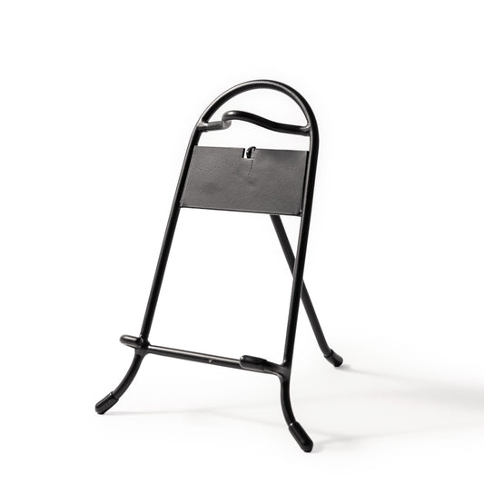 Black metal skillet stand.