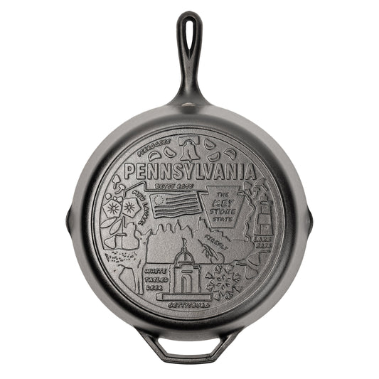 Cast iron skillet with the bottom engraved with beloved icons and monuments from Pennsylvania.