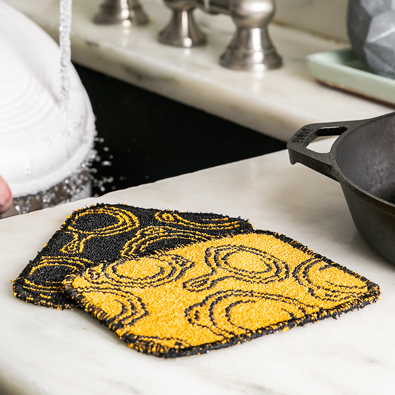 Scrub cloth on kitchen counter.