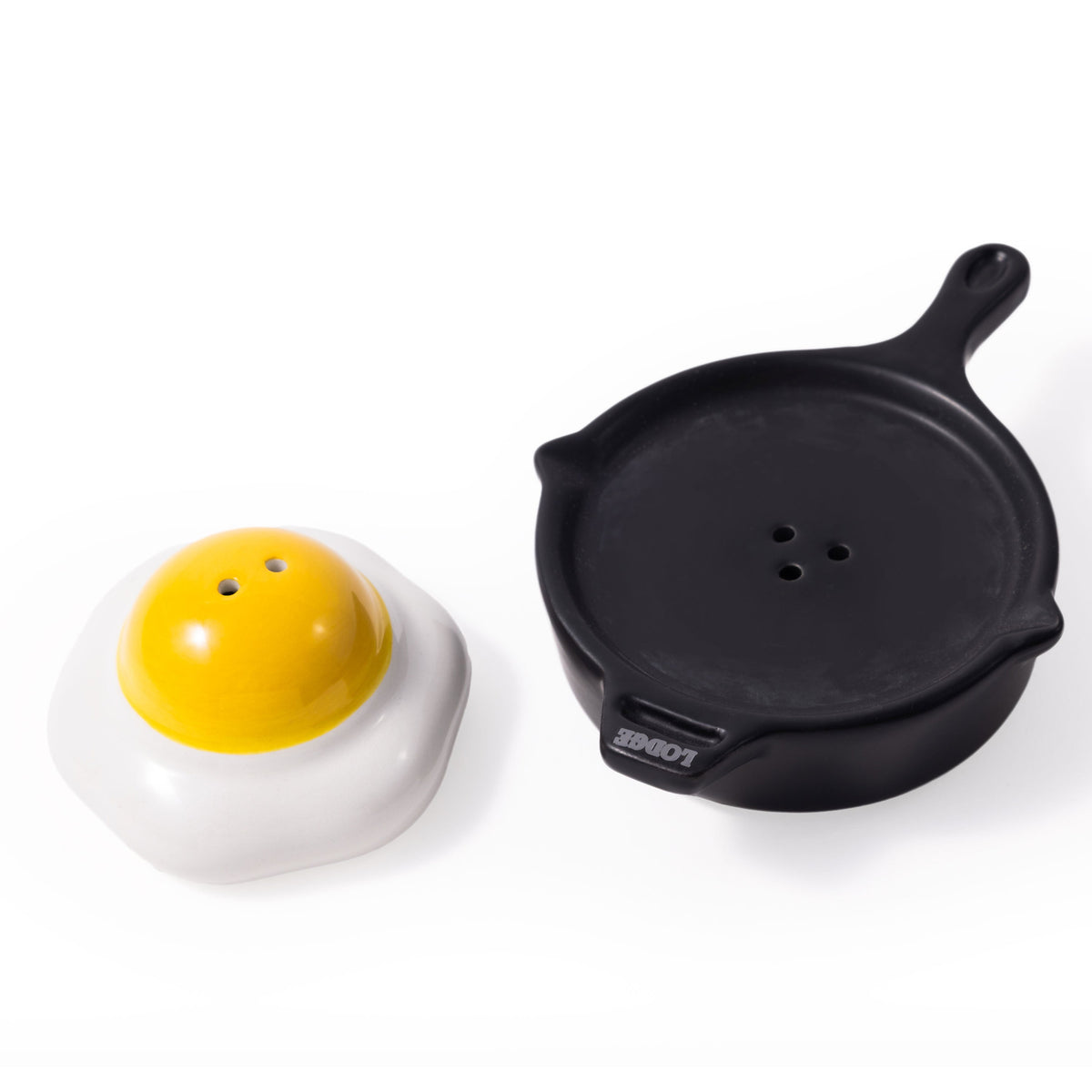 Two novelty items shaped like a fried egg with a yellow yolk and a frying pan on a white background.