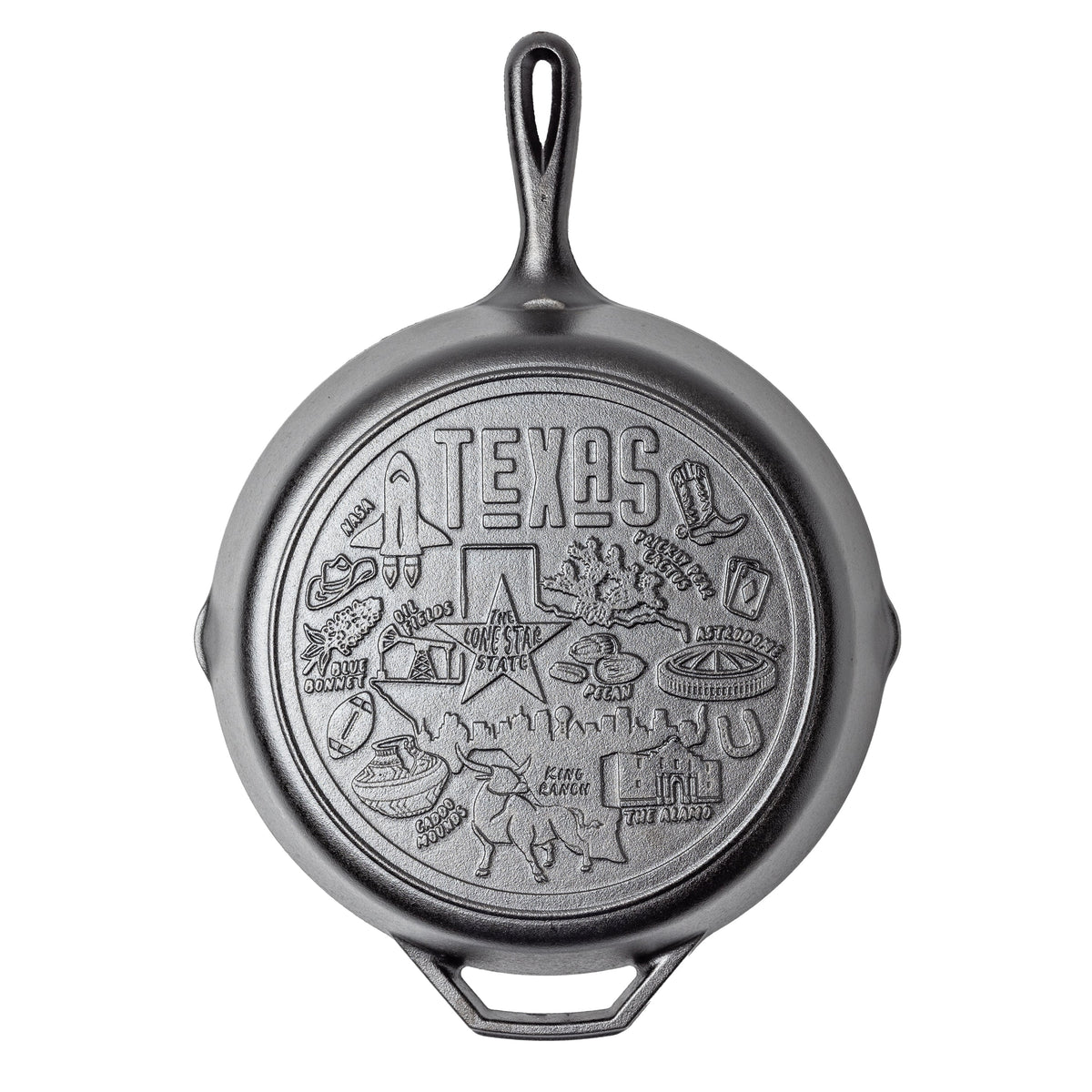 Cast iron skillet with Texas-themed engravings on a white background