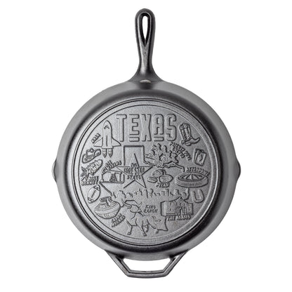Cast iron skillet with Texas-themed engravings on a white background