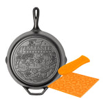 The Tennessee American Road trip Skillet, featuring loved monuments and icons of the Volunteer State, paired with an orange silicone handle holder and trivet.