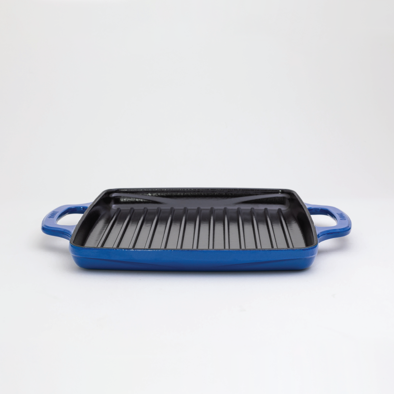 Enameled, square grill pan with a blue exterior and a black cooking surface.
