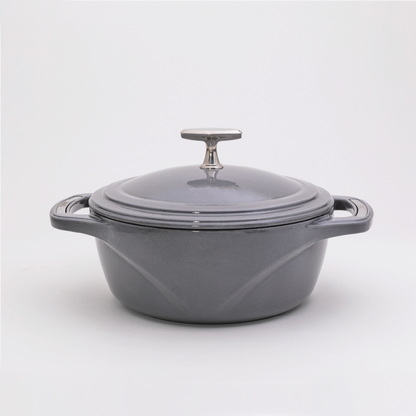 Grey enameled cast iron Dutch oven with a lid on a white background