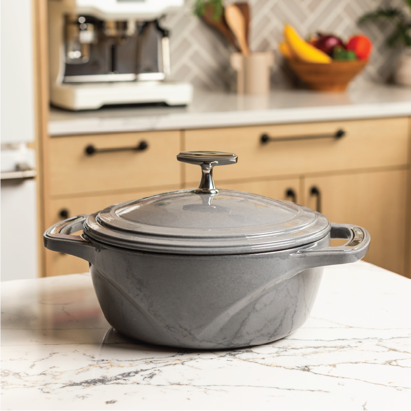 Grey dutch oven on kitchen counter top.