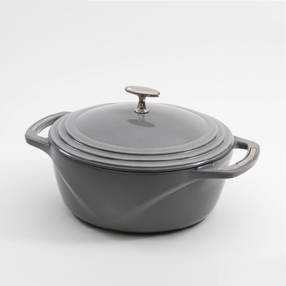 Grey enameled cast iron Dutch oven with a lid on a white background