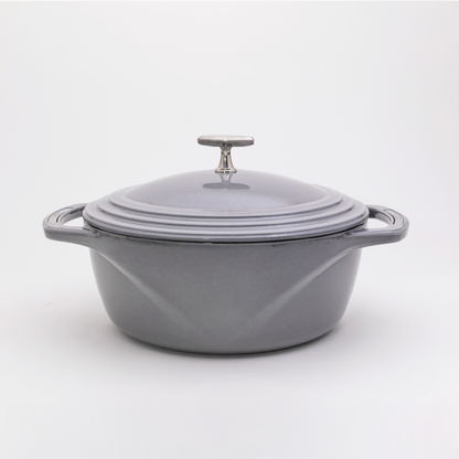 Grey enameled cast iron Dutch oven with a lid on a white background