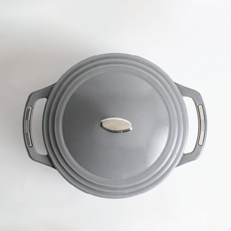 Top view of grey dutch oven featuring silver knob on lid and silver accents on handles.