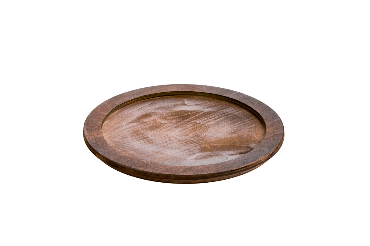 A circular wooden underliner with indent for skillet or other serving dish.