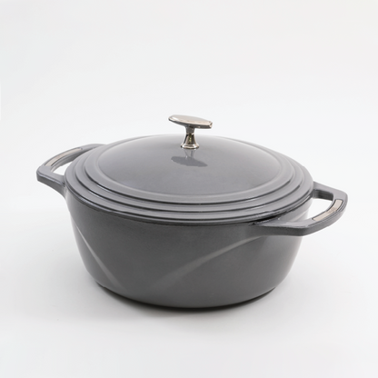 Grey enameled cast iron Dutch oven with a lid on a white background