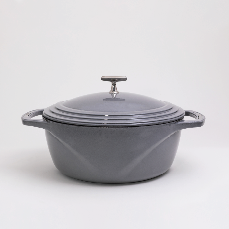 Grey enameled cast iron Dutch oven with a lid on a white background