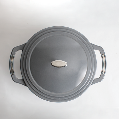 Top view of grey dutch oven featuring silver knob on lid and silver accents on handles.