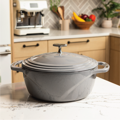 Grey dutch oven on kitchen counter top.