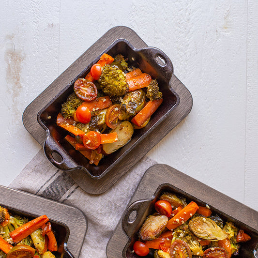 Roasted vegetables served in rectangular mini server on top of underliner.
