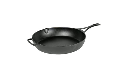 A black, cast iron skillet with a long handle and a loop handle on other side, along with two pour spouts on opposite sides.