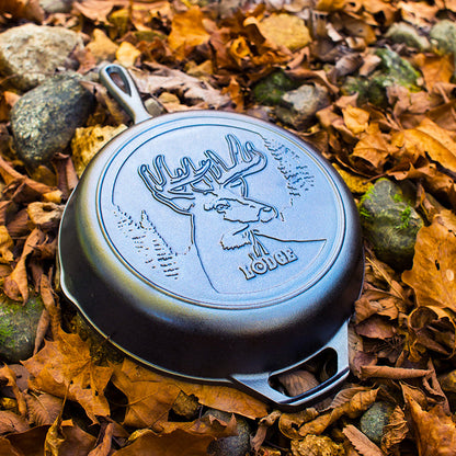 Skillet on forest ground displaying embossed design.