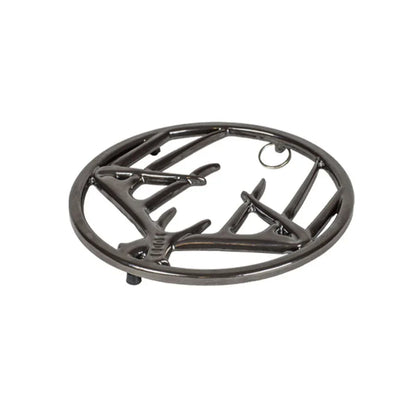 Black midnight chrome enamel trivet with decorative antler design on a white background