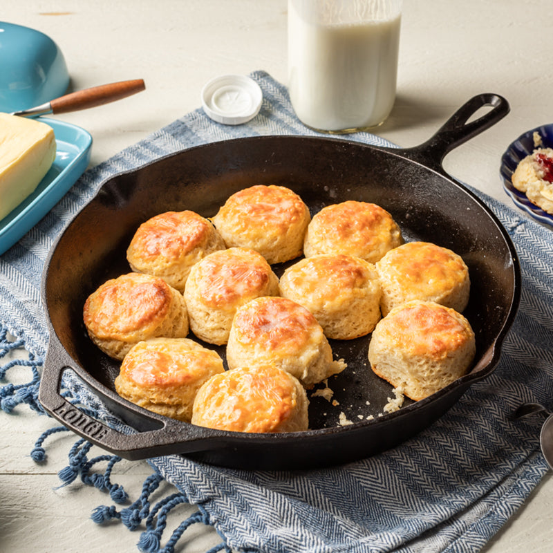 Fresh buttery biscuits in cast iron skillet.
