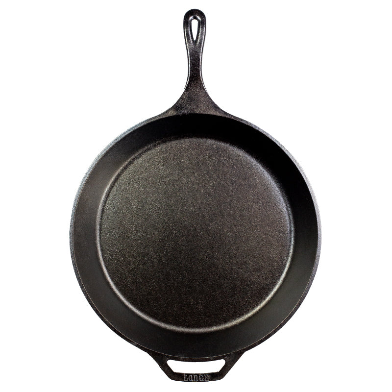 Cast iron skillet with one long handle and one assist handle on opposite side.