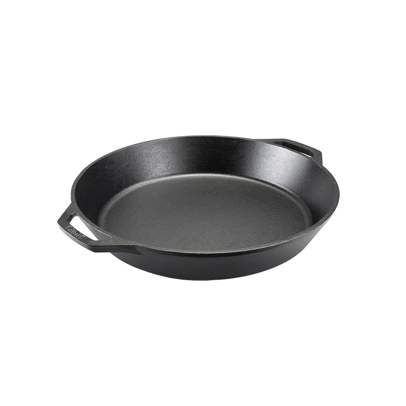 Black cast iron skillet with two loop handles.