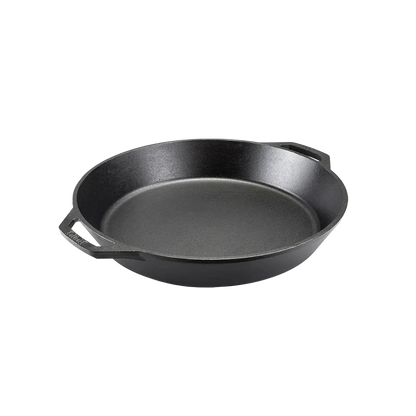 Black cast iron skillet with two loop handles.
