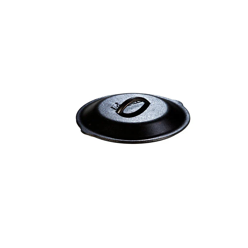Seasoned cast iron lid with Lodge branding and handle in the middle.