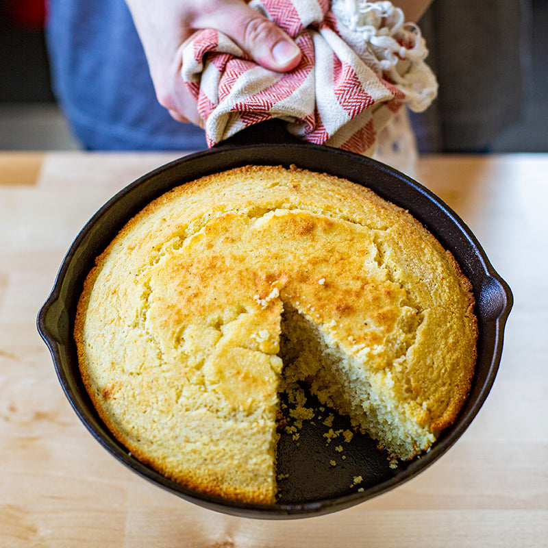 Partially eaten cornbread, made in skillet.