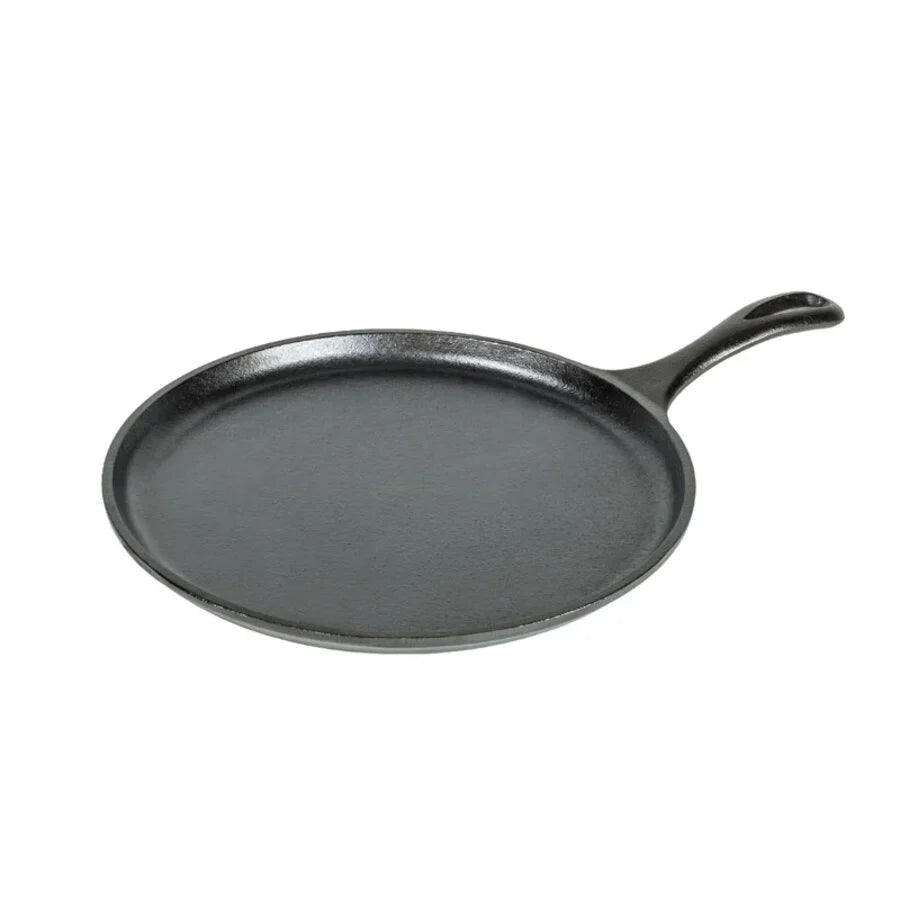 A black cast iron circular griddle with a long handle.
