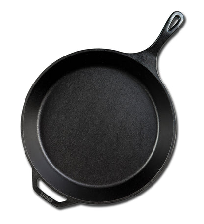 Cast iron skillet with one long handle and one assist handle on opposite side.