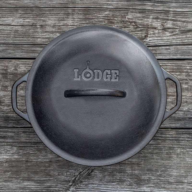 Top view of dutch oven with lid, featuring Lodge branding and lid handle.