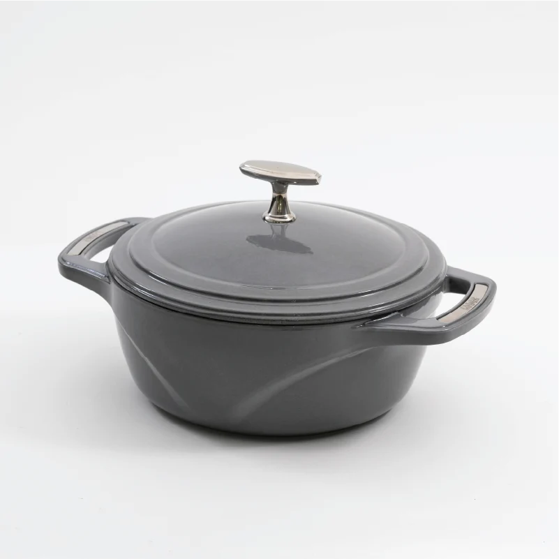 Grey enameled cast iron Dutch oven with a lid on a white background